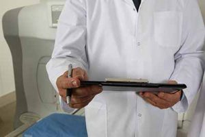 A doctor uses the Health IT on his tablet to upload patient records and speed up their social security disability claim.