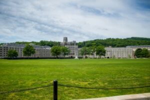A view of the Plain at West Point University in Orange County New York shows open grass fields and buildings in the background.